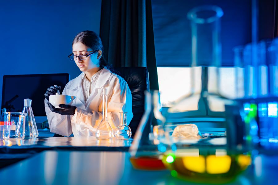 A scientist examines probiotics in a lab.